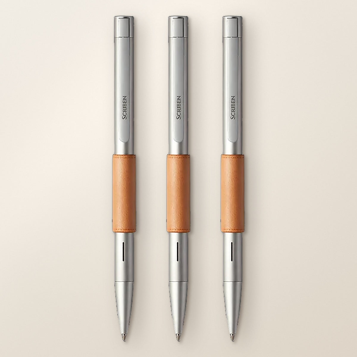 Scriben 3-Pack in Silver: three silver pens with tan leather grips