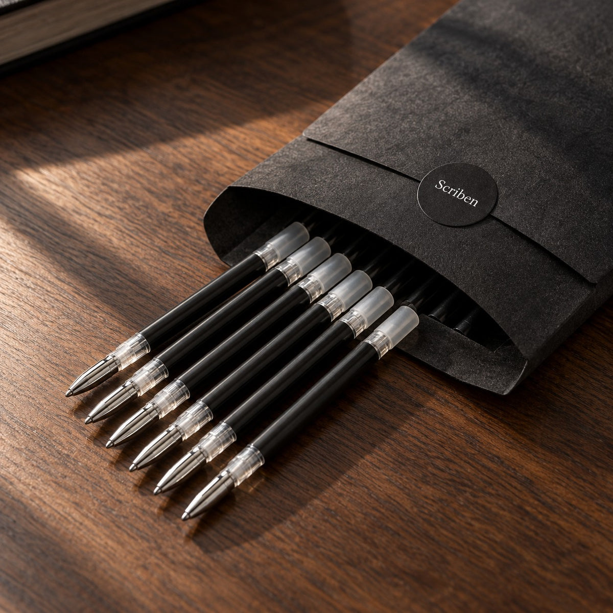 Scriben black-ink refills sliding out of a Scriben sleeve